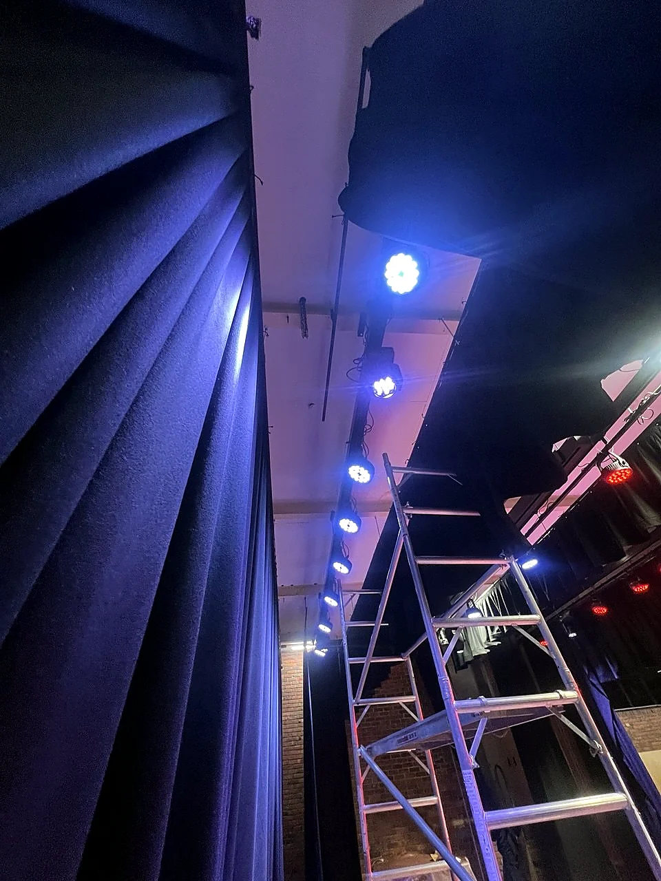 Blue-lit stage and venue lighting